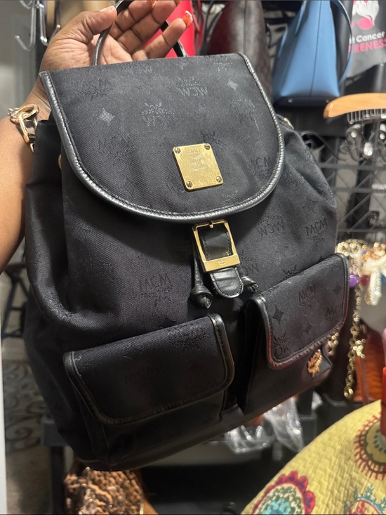 MCM Handbags - MCM Black Embossed Leather Backpack with Gold Hardware